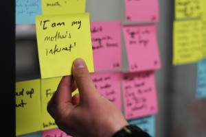i am internet Hand holding a Post-it note with user quote 'I am my mother's internet'.
